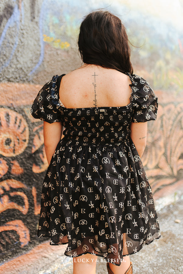 Black Cattle Brand Printed Puff Short Sleeve Flutter Dress